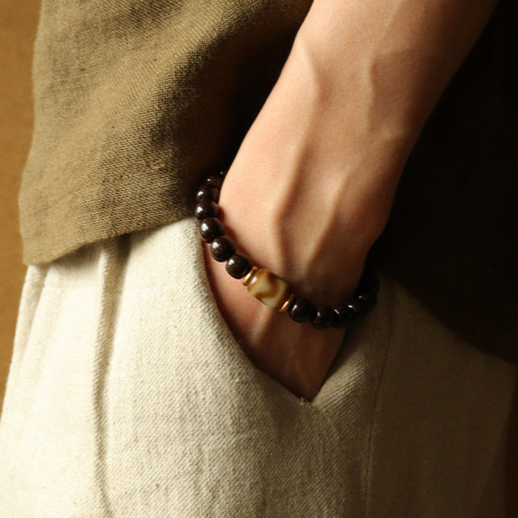 Solar Raven – Black Power Beads with Ivory Fang Accent Bracelet