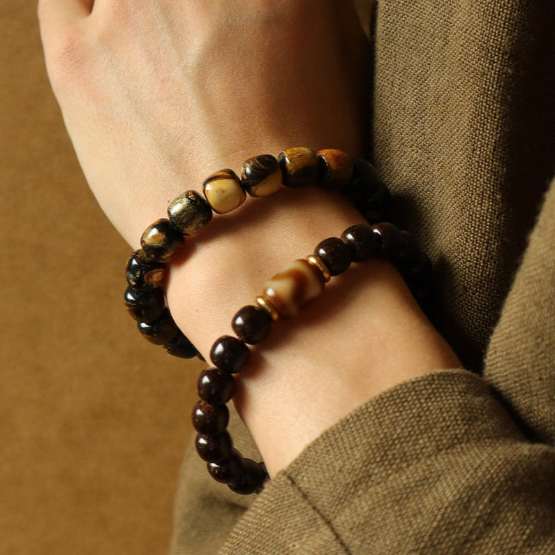 Solar Raven – Black Power Beads with Ivory Fang Accent Bracelet