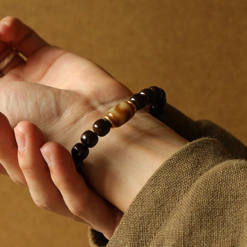 Solar Raven – Black Power Beads with Ivory Fang Accent Bracelet