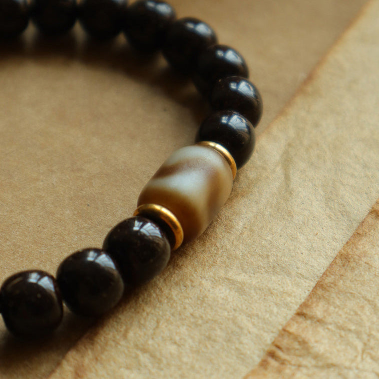 Solar Raven – Black Power Beads with Ivory Fang Accent Bracelet